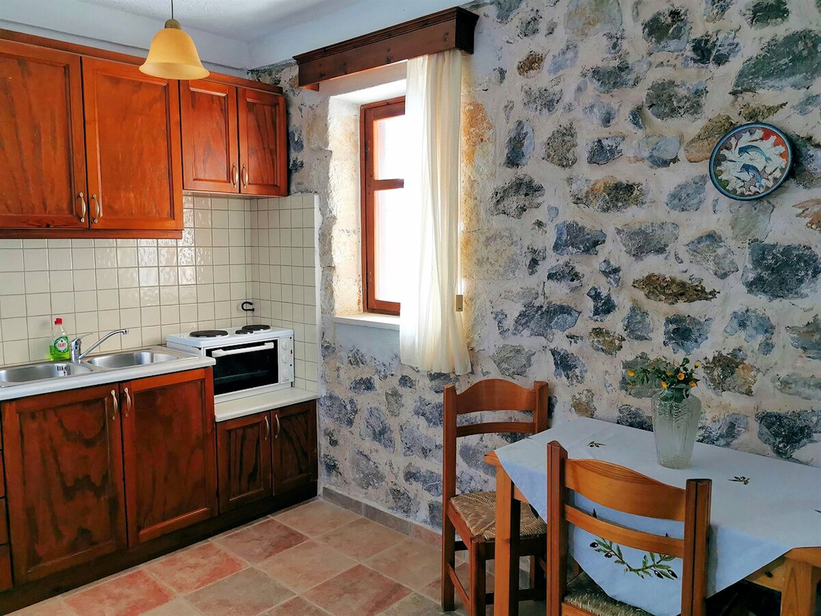 Kitchen and dining area inside a self-catering Cavo Ponta apartment