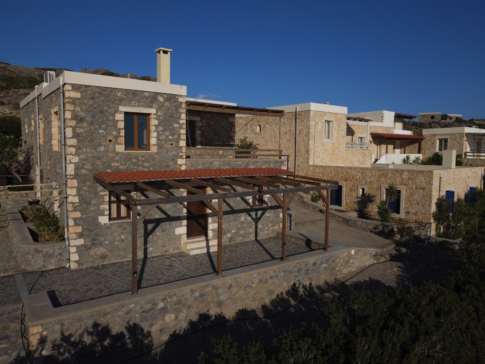 Stone-built Cavo Ponta accommodation with terraces below the South Cretan sky