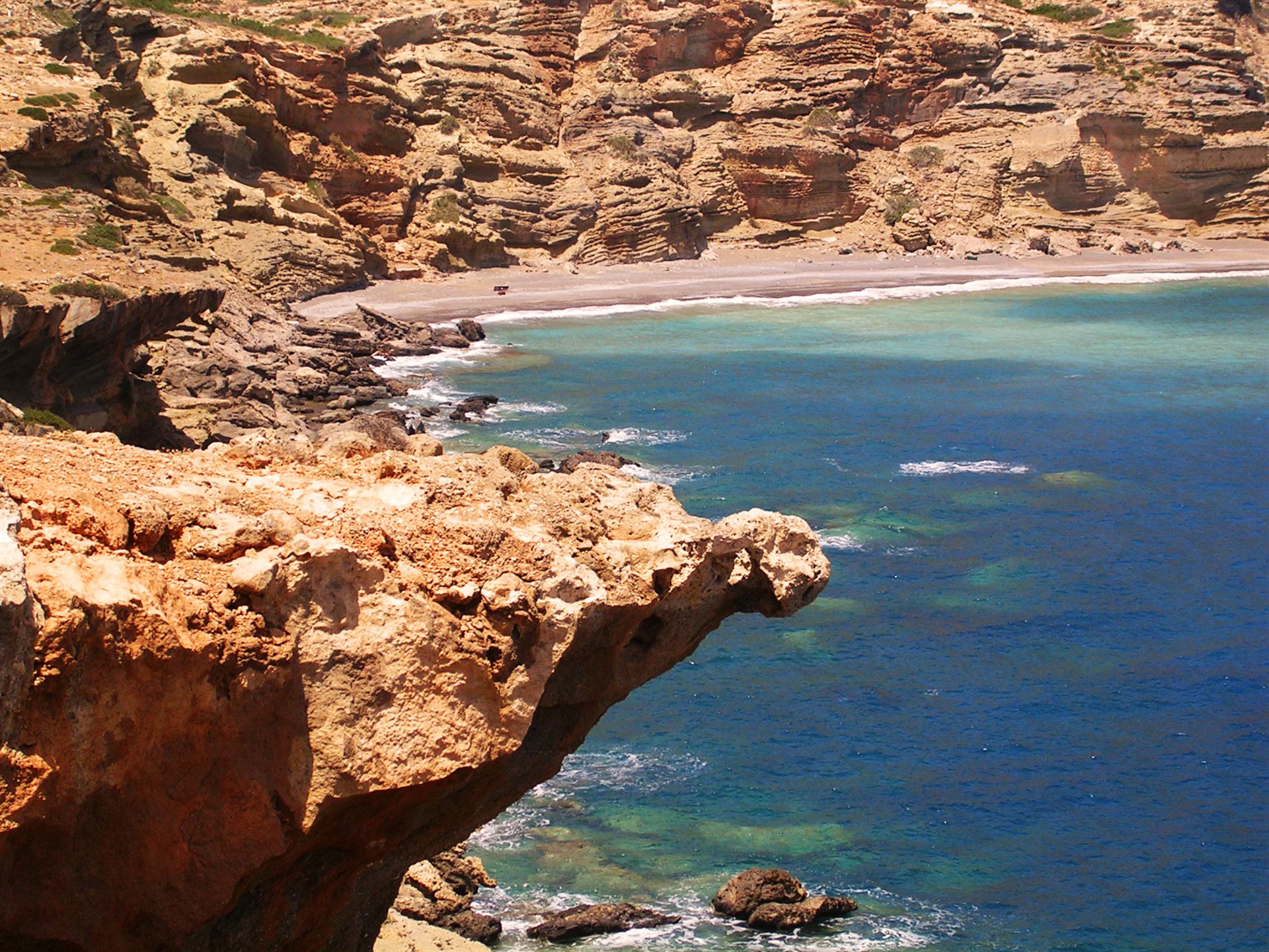 Rocky coastal route above clear water on the South Cretan shore