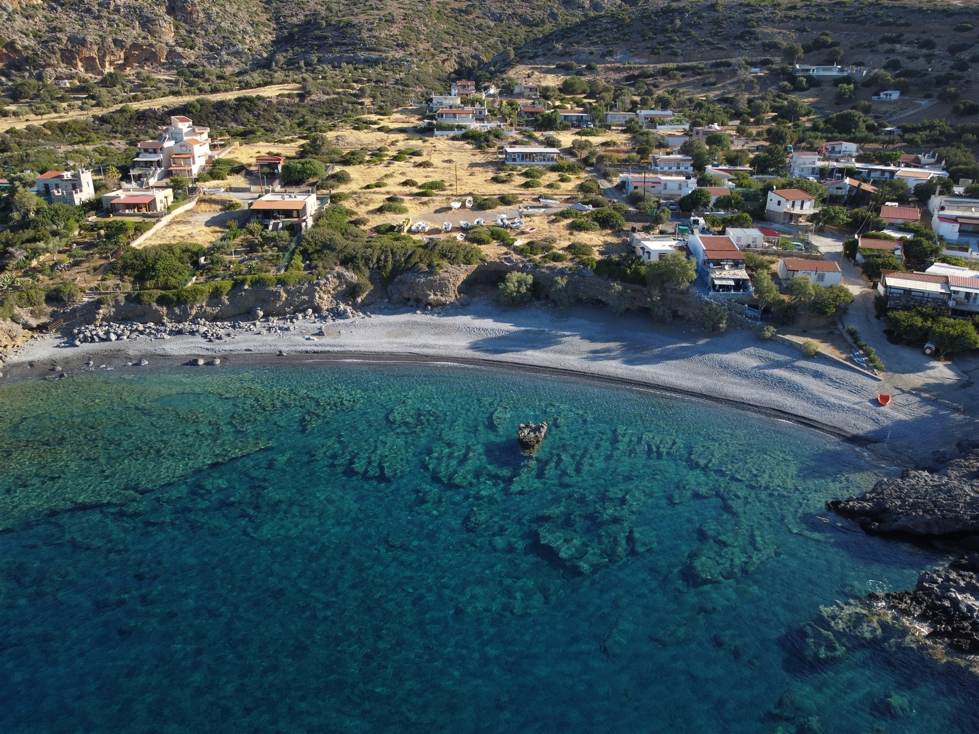 Aerial view of Agios Ioannis beach below the Asterousia mountains